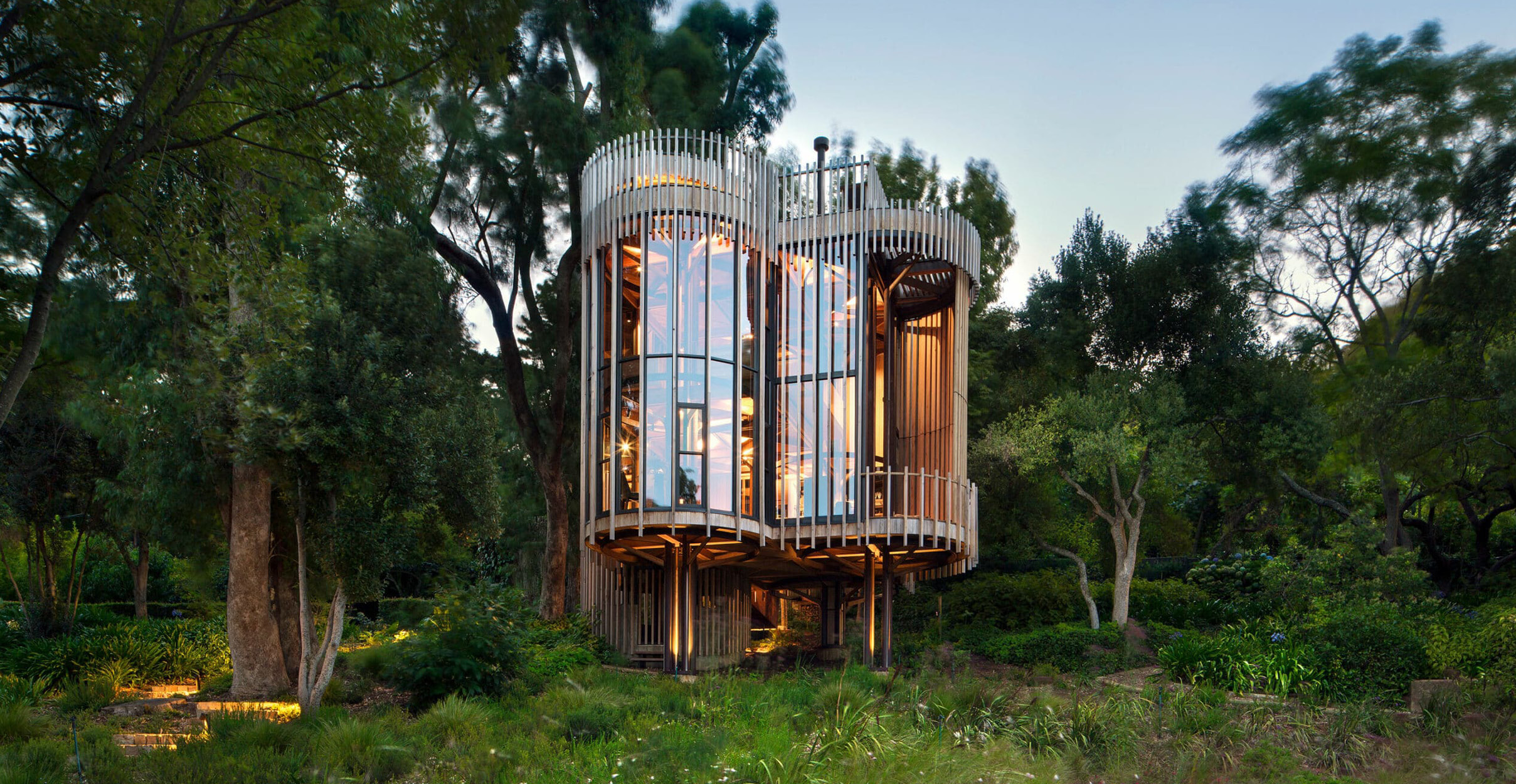 Wooden circular buildings elevated off the ground