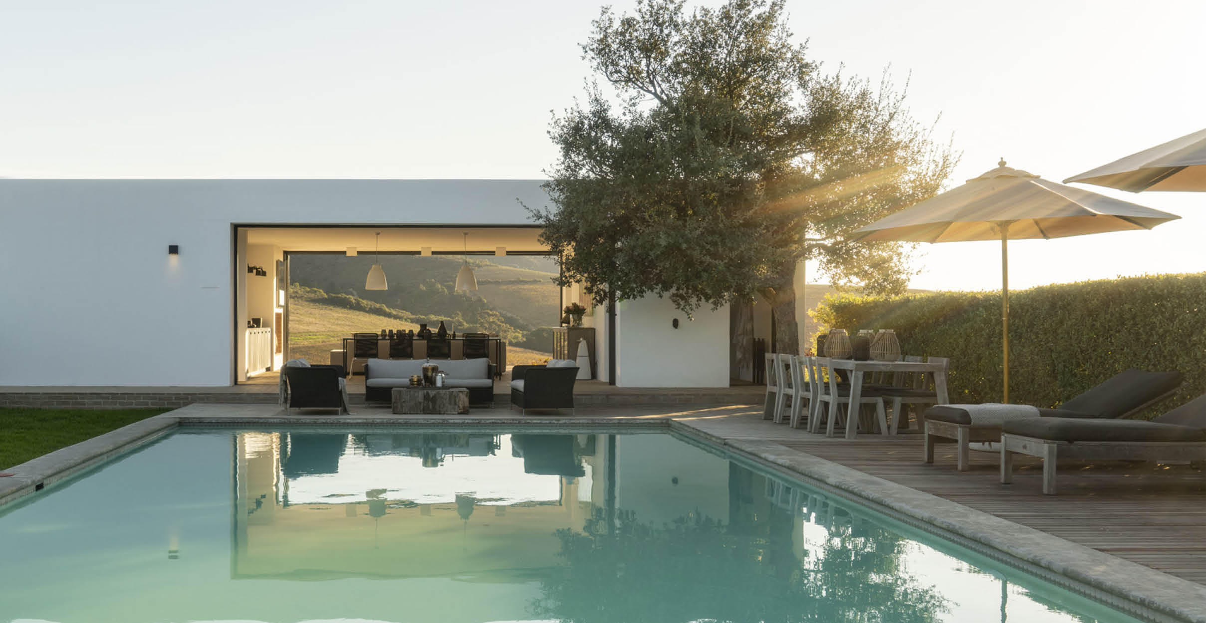 Modern white pool pavilion with large pool