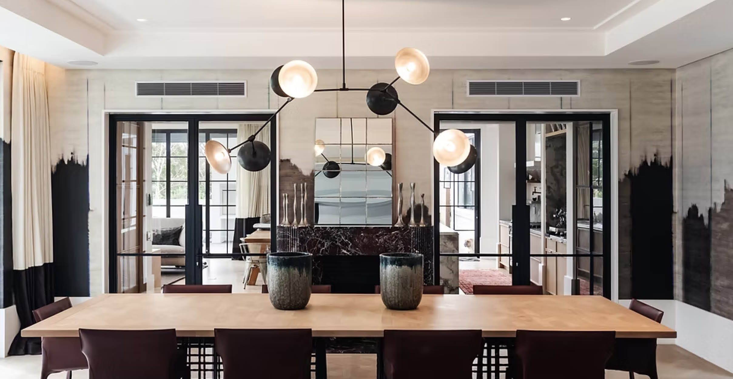 Modern black chandelier in dining room
