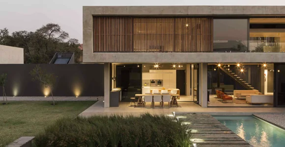 Double storey residential concrete modern home with wooden slats